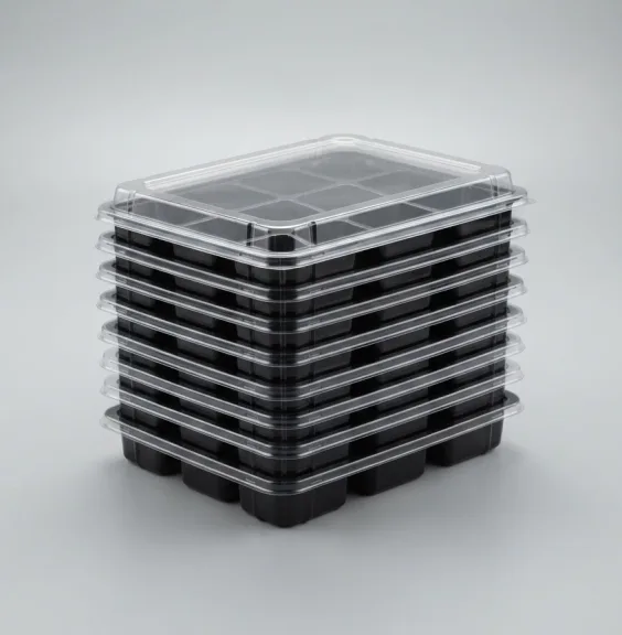 Stack of black thermoformed packaging trays